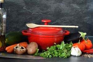 Pot, spoon and vegetables